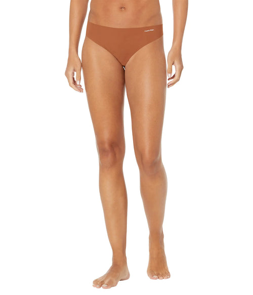 Calvin Klein Womens Invisibles Seamless Thong Panties 5 Pack Desert Sand Dune/White Pepper/Brass Brown/Black/Black Small
